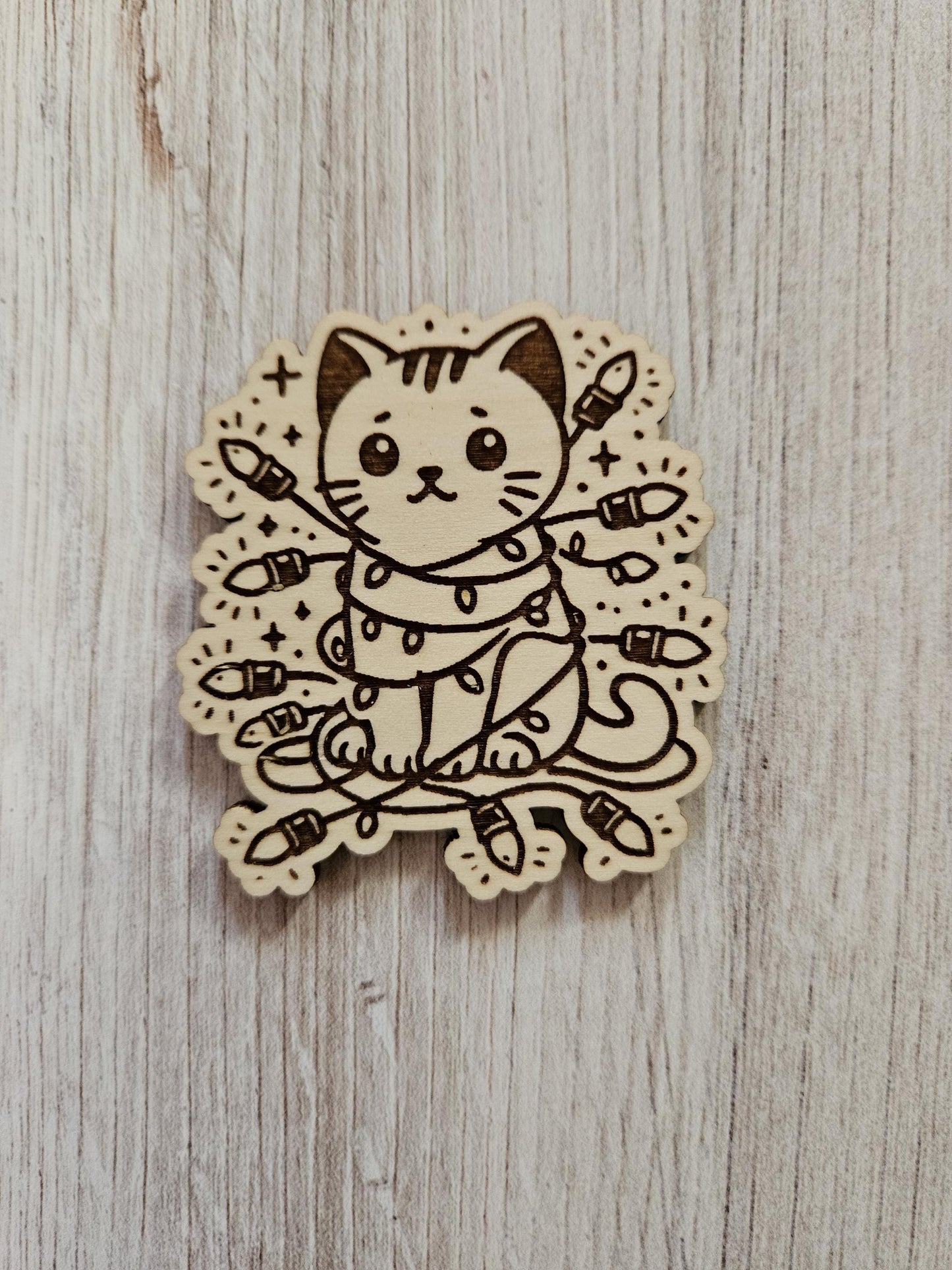 Cat Wrapped In Christmas Lights Needle Cover Minder