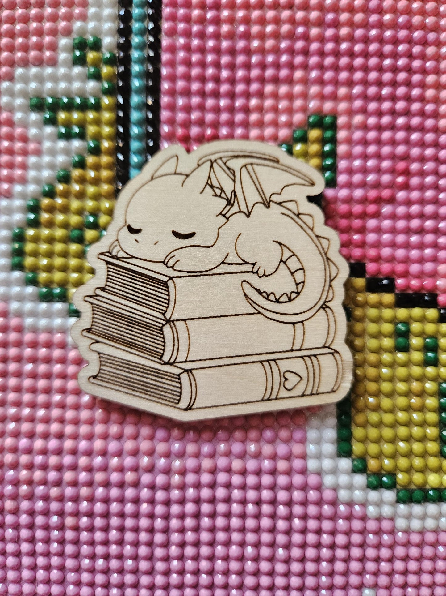Baby Dragon Sleeping On Books