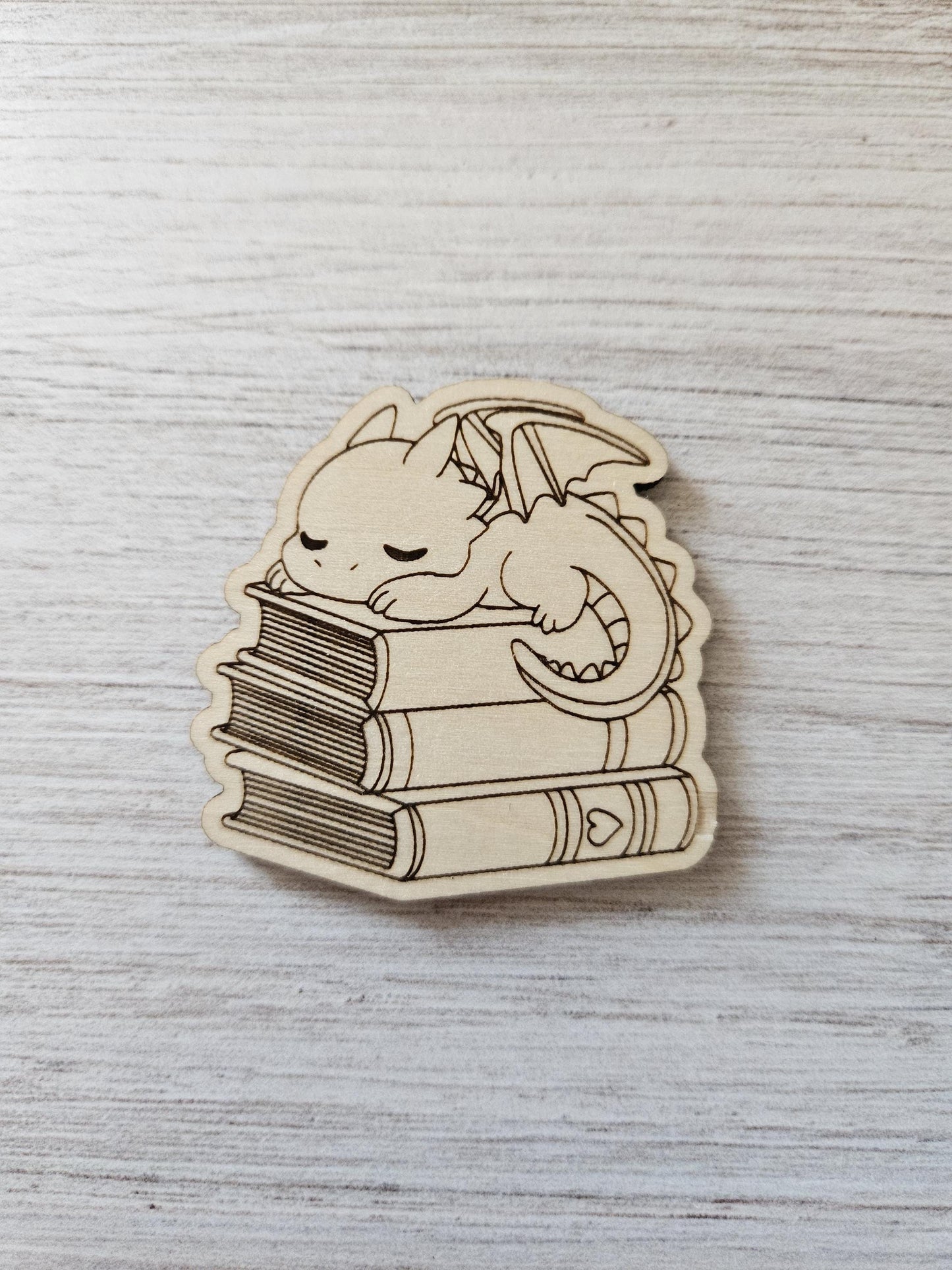 Baby Dragon Sleeping On Books