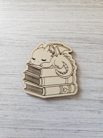Baby Dragon Sleeping On Books
