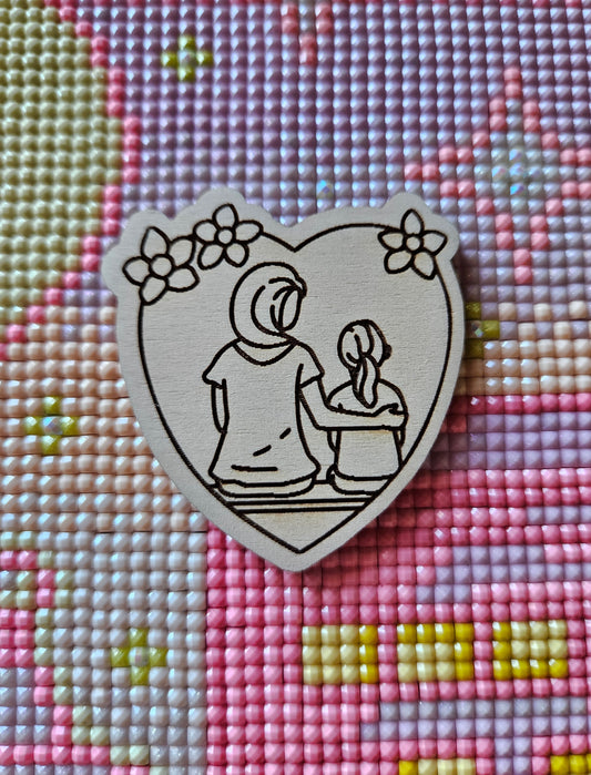 Mother and Daughter Sitting Minder